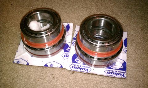 1990 Ford Bronco - Two Yukon Gear & Axle wheel bearings are shown, packaged on their original material.