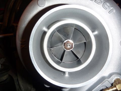 1997 Dodge 2500 - A close-up view of a turbocharger's internal components, showing the compressor wheel and housing.