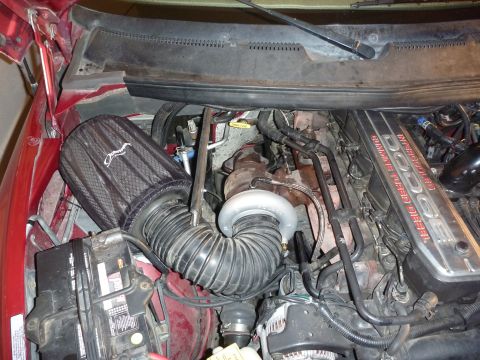 1997 Dodge 2500 - Close-up of a 1997 Dodge 2500 engine, highlighting the Cummins Turbo Diesel branding and an aftermarket air intake.