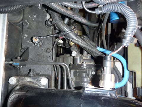1997 Dodge 2500 - Detail shot of engine components, focusing on the fuel injection system and wiring harness.