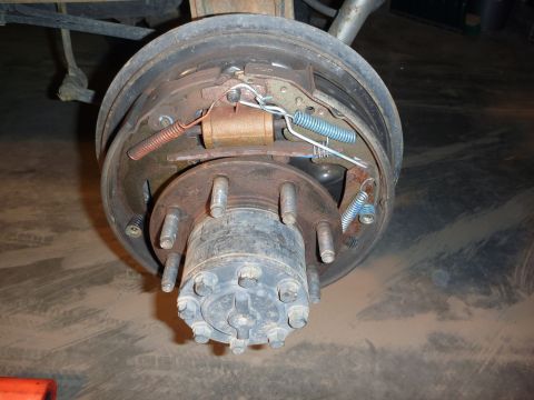 1997 Dodge 2500 - Close-up view of a rear drum brake assembly, showing internal components like springs and the brake cylinder.