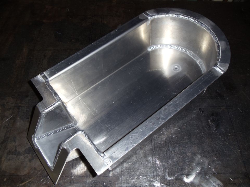 Aluminum footwell tray with visible welds and a textured surface