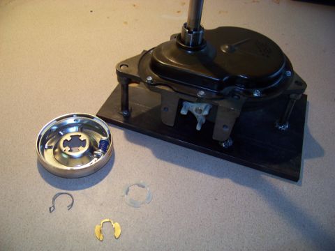 1994 Ford F-150 - Disassembled transmission part, including clutch and springs, is laid out on a workbench for inspection or repair.