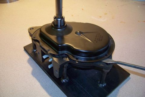 1994 Ford F-150 - A transmission part is secured to a jig for inspection or work.