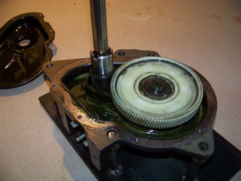 1994 Ford F-150 - Close-up view of a transmission's internal gear mechanism, showing a large white gear and a metal shaft.