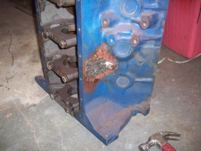 1969 Ford Torino - A blue engine block shows significant rust damage on its side. The registry claims it is a 1969 Ford Torino, but this is a part, not the wh…