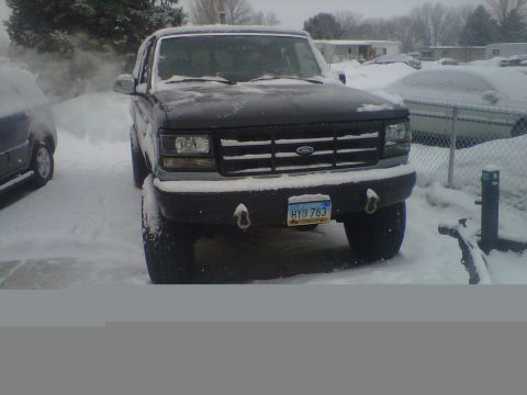 1994 Ford F-150 - This 1994 Ford F-150 is seen from the front, covered in snow.