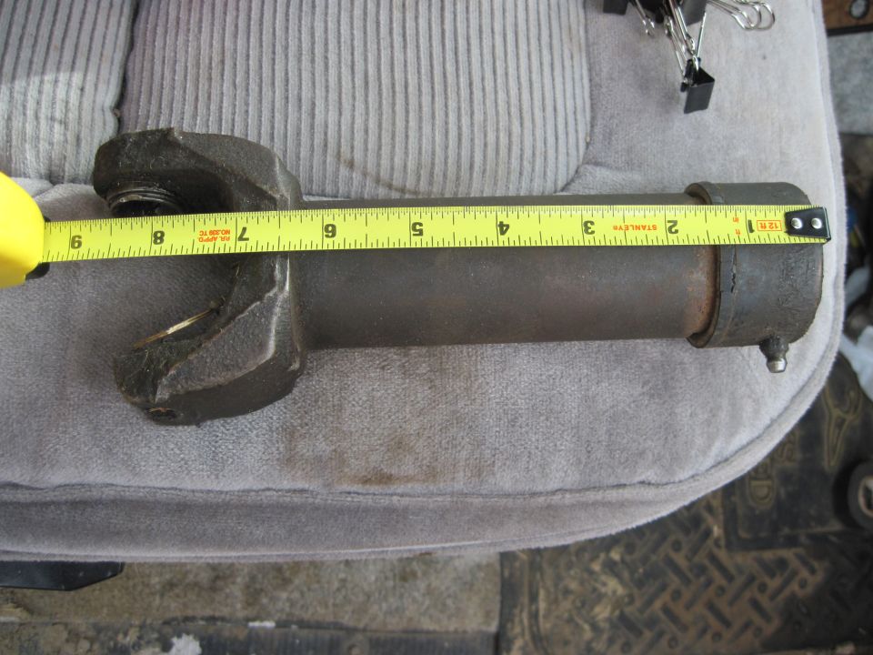 Driveshaft part measured with a tape measure