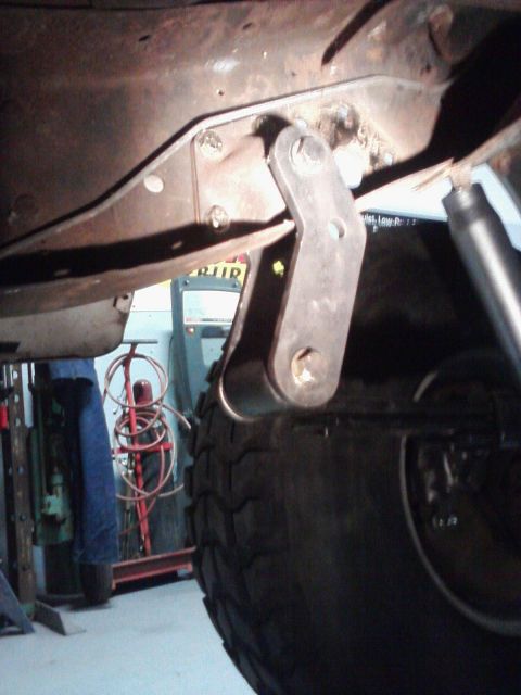 1971 International School Bus - A close-up view of a vehicle's undercarriage, focusing on a suspension component.