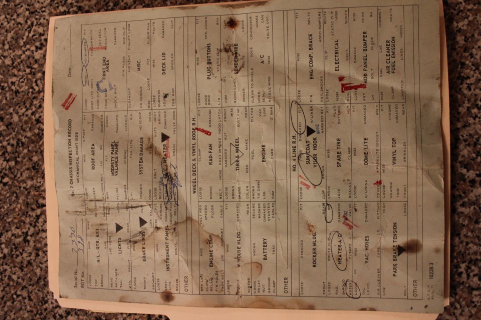 Chassis inspection record document with handwritten notes and red marks
