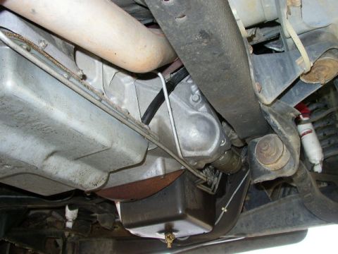 1995 Ford Bronco - Underside of a vehicle, focusing on the transmission and exhaust system.