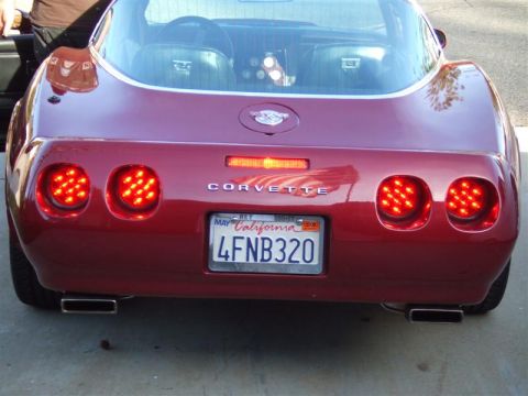 1976 Chevrolet Corvette - The rear of a red 1976 Chevrolet Corvette shows its distinctive taillights and the 'CORVETTE' script.