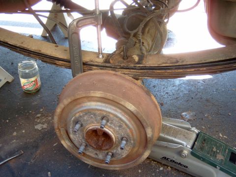 1995 Ford Bronco - I dropped the axle just enough so that I could get the leaf’s in, after I got everything lined up correctly I used a 9” C-clamp to compress…