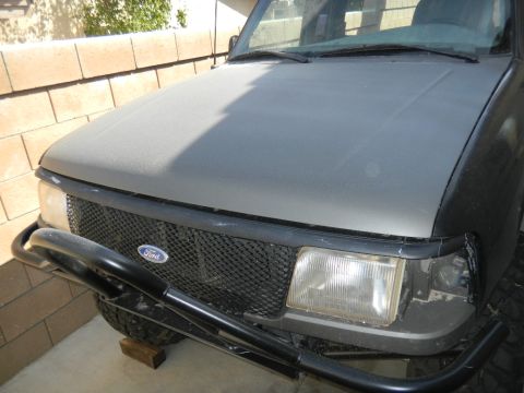 1997 Ford Ranger - Front view of a 1997 Ford Ranger, showing the grille, headlights, and a bull bar.