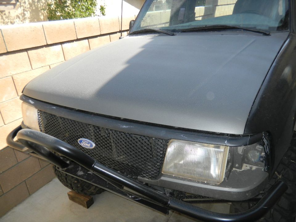 1997 Ford Ranger front grille and headlights with a black bull bar
