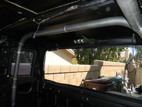 1997 Ford Ranger - A custom roll cage is visible inside the vehicle's interior, with a view of the outdoors through the windows.
