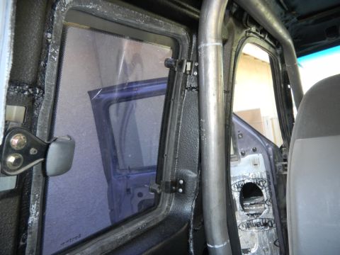 1997 Ford Ranger - Vehicle interior modified with a roll cage and sound deadening material.