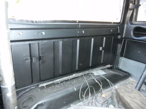1997 Ford Ranger - The interior of a truck bed shows a black spray-on liner and loose wiring.