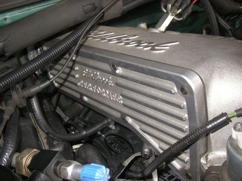 1990 Ford Bronco - An Edelbrock cast-aluminum intake manifold installed on an engine, with 'Edelbrock' and 'Edelbrock Performer' cast into the finned plenum,…