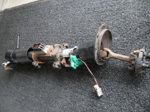 1973 Ford Ranchero - This steering column assembly features electrical connectors and a U-joint, likely from an older vehicle.
