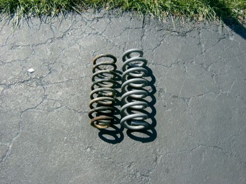 1995 Ford Bronco - New spring next to old, not a huge difference but the old one was so warn it would compress about 3” once the full weight was put on it.