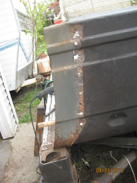 1983 Ford Bronco - This photo shows a close-up of a heavily rusted and welded vehicle body panel, likely undergoing repair.