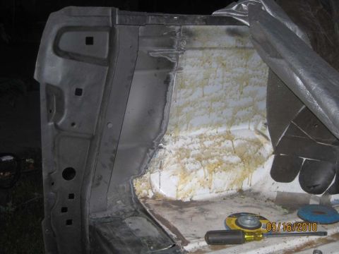 1983 Ford Bronco - Close-up view of an interior vehicle panel showing yellow staining and evidence of recent work, with a date stamp of 05/16/2010 visible.