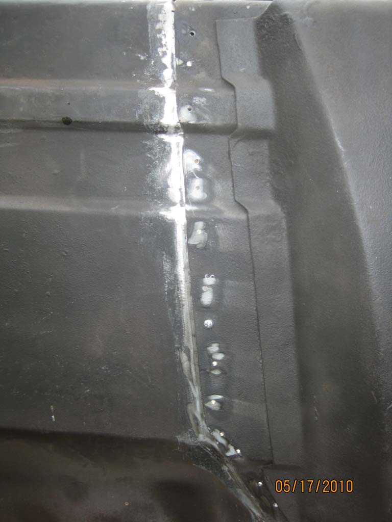 Welded seam on black metal panel