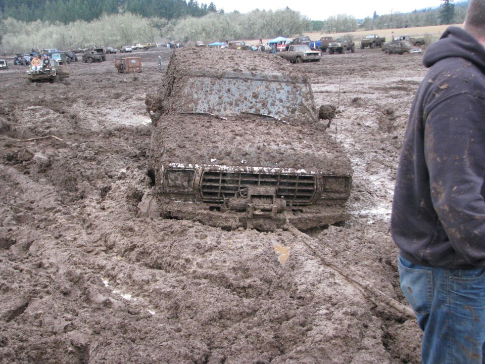 1978 Ford Bronco stuck deep in mud at off-road event