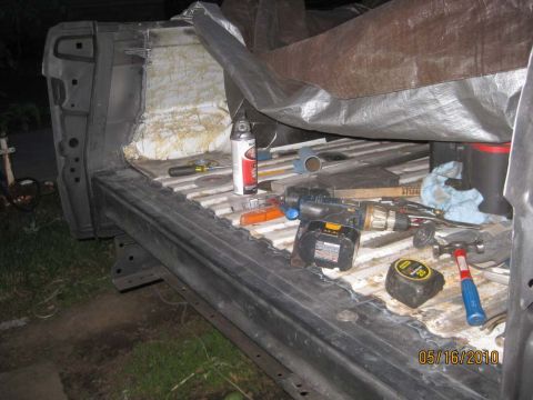 1983 Ford Bronco - Tools are laid out in the bed of a truck, suggesting ongoing repair or modification work.