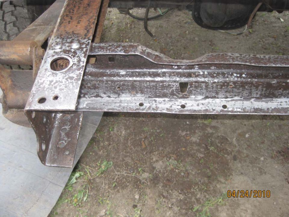 Here I had cleaned up the rust on the cross member and treated it with Metal Ready.