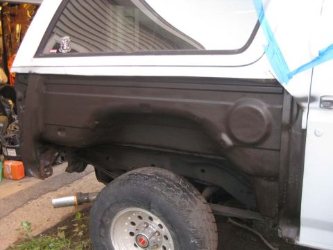 1983 Ford Bronco - As I exposed the inner tub, I removed the surface rust, treated it, covered with undercoat and sealed the undercoat with black rust retarde…