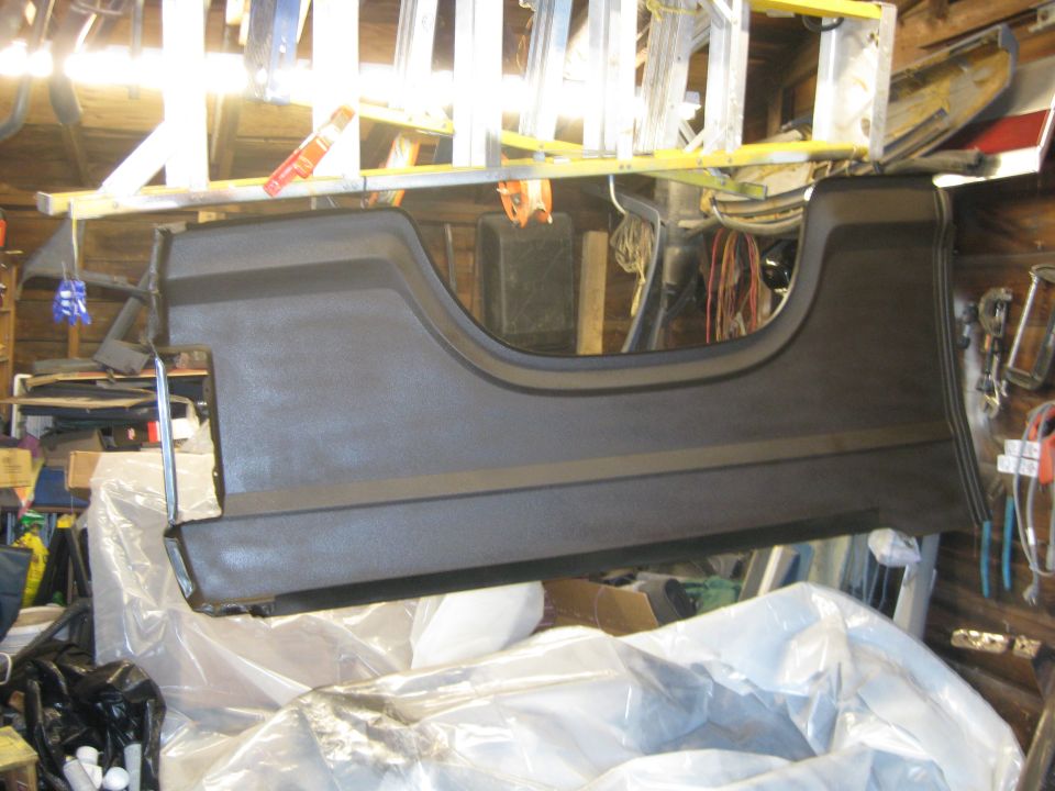 Inside of new 1/4 panels covered with undercoat and sealed to give the undercoat a harder surface.