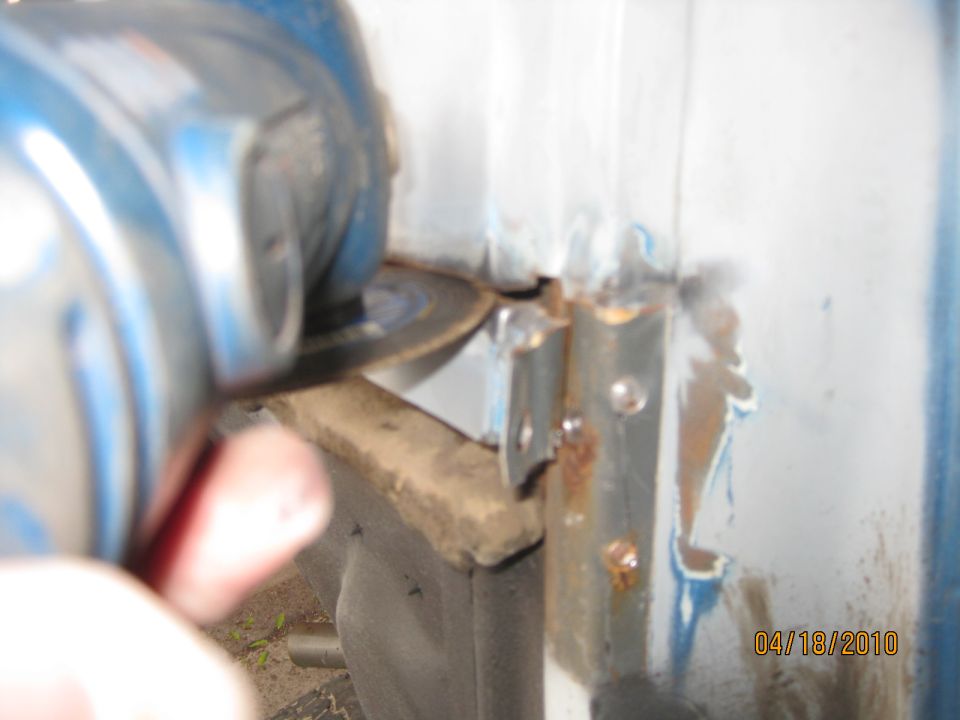 And then carefully cut the welds with a cut off wheel using my angle grinder.  By the way that wheel will cut you if you are not careful.  I've got the scar on 'the side of my hand to prove it.  It came within a 1/4 inch of cutting the artery that runs along the side of your wrist.  SAFETY NOTE: Don't do this at home. WEAR PROTECTIVE GLOVES, "DUH".  I was too lazy to put them on and they were setting right next to me.