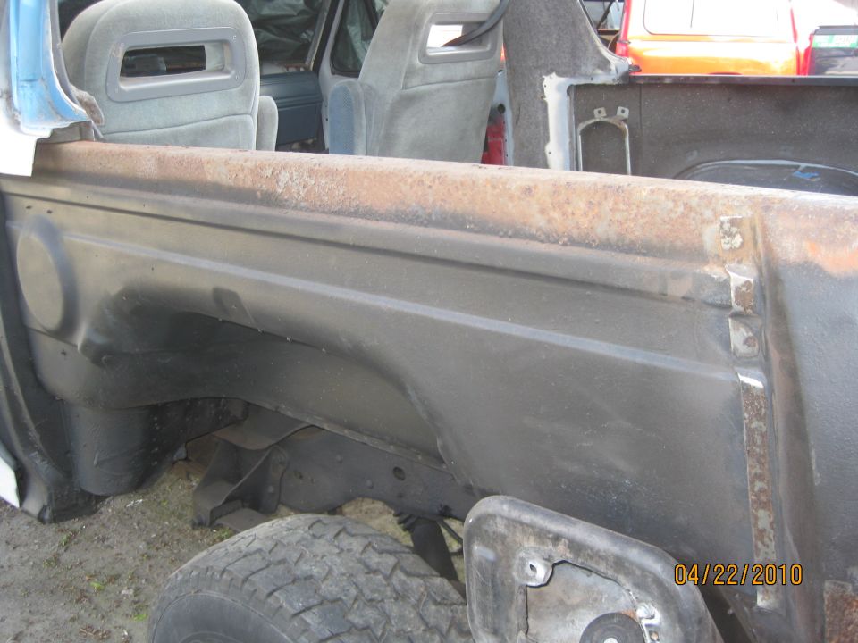 See that flaky looking rust along the edge? Well, the whole side of the tub was like that.  In the process I buffed off the rust material, treated it with Metal Ready, sealed with rubberized under coat, and sealed that with Rustoleum high performance flat black paint.