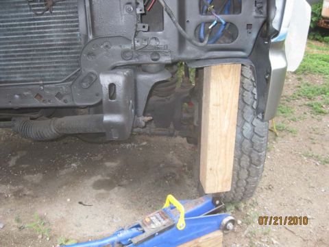 1983 Ford Bronco - Used a jack to lift the radiator support and make room to cut out the old mounting hardware.