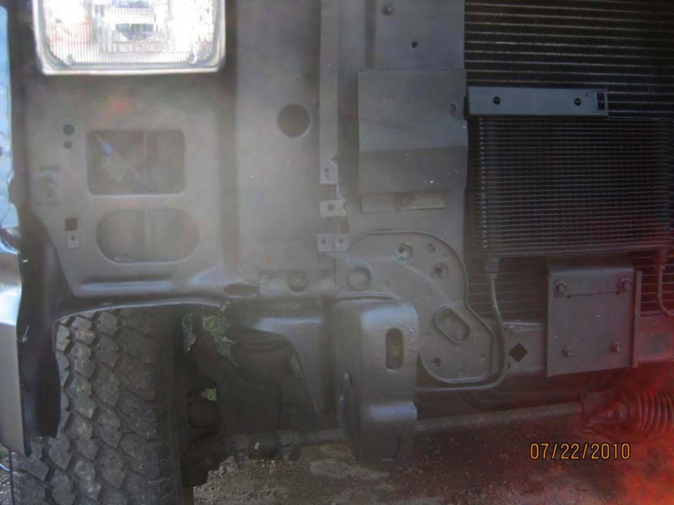 Front frame and inner fender of a truck with large tire, dated 07/22/2010