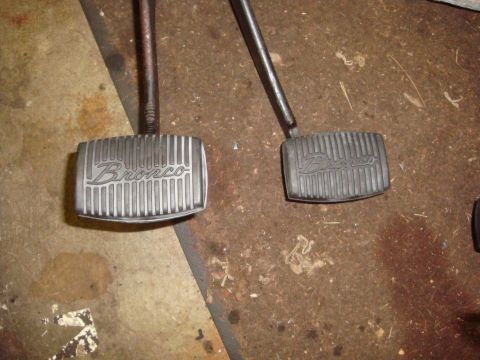 1989 Ford Bronco - Two pedals, one silver and one black, both embossed with the word "Bronco".