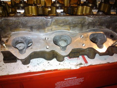 1995 Ford Probe - Close-up of engine cylinder head intake ports, showing internal components.
