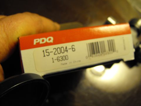 1982 Chrysler New Yorker - A PDQ part box is held, showing part numbers 15-2004-6 and 1-6300, with 'Made in China' visible.