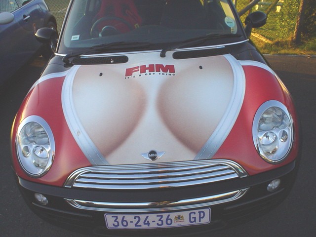 Red Mini Cooper front end with FHM magazine promotional hood graphic and GP plate