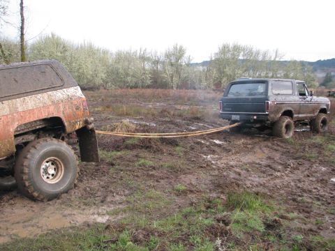 1978 Ford Bronco - A 1978 Ford Bronco pulls a stuck vehicle out of a muddy off-road course.