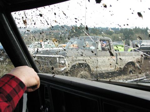 1978 Ford Bronco - Muddy 1978 Ford Bronco navigating a challenging off-road course.
