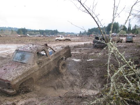 1978 Ford Bronco - Pickup truck stuck deep in mud during an off-road event.