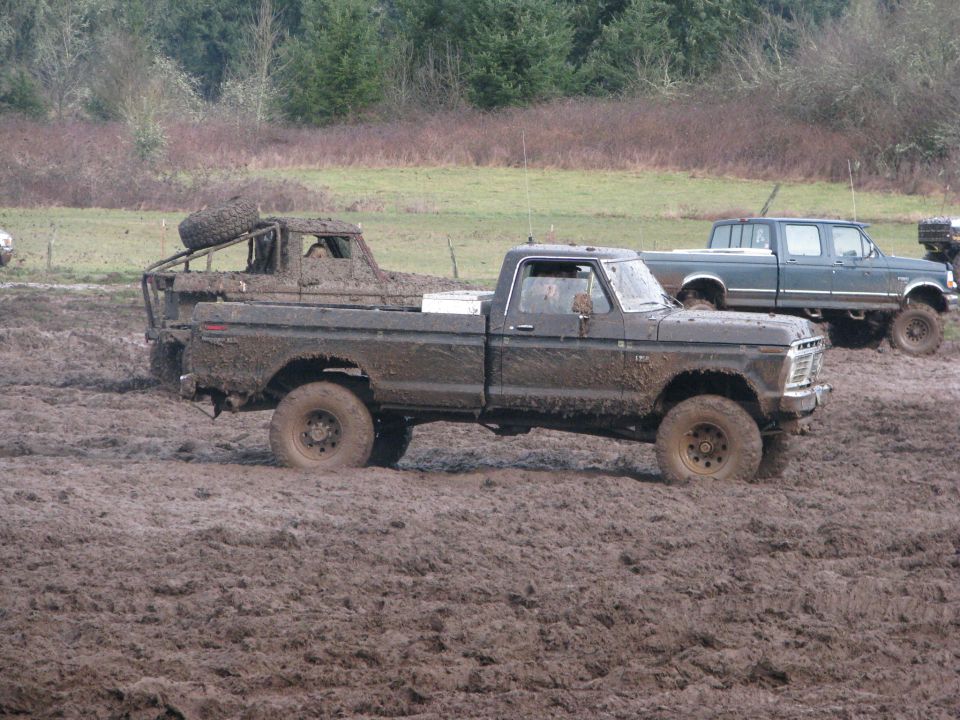 Mud-covered 1979 Ford F-Series pickup truck in mud pit