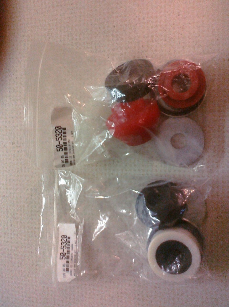 Bags of suspension bushings, one labeled 50-5320