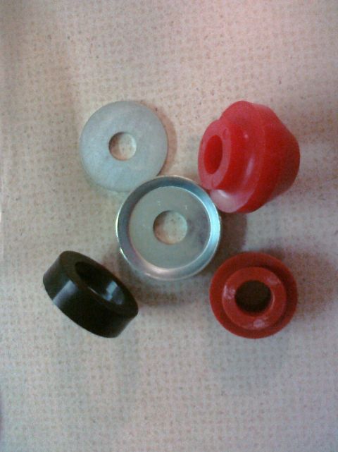 1995 Ford Bronco - Set of suspension bushings and washers, likely for aftermarket upgrades.