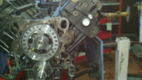 2002 Ford Excursion - Engine block with timing gear assembly visible, likely in a workshop setting.