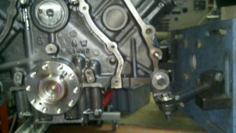 2002 Ford Excursion - Engine block detail with attached mechanical parts and hardware visible.