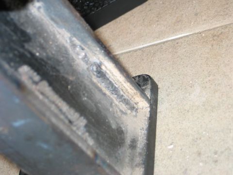 1984 Ford Bronco - This image shows a close-up view of a welded metal component, likely part of a vehicle's chassis or frame.